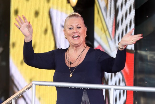 Kim Woodburn leaves the Big Brother house and waves to the public.