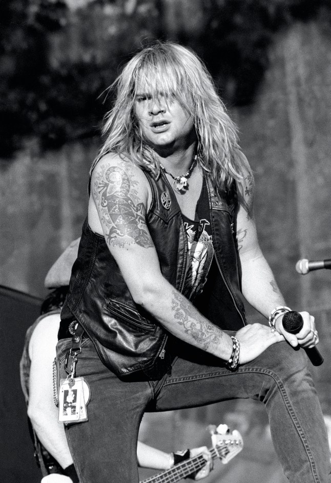 Lead singer David Roach is shown performing on stage during a live concert appearance with Junkyard on July 28, 1991 in Bristol, Connecticut. (Photo by John Atashian/Getty Images)