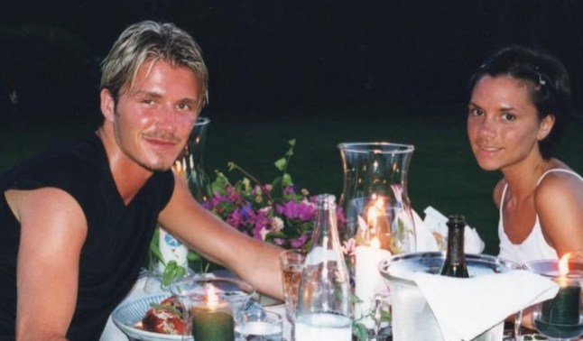 David and Victoria Beckham sitting at a dining table in a throwback photo