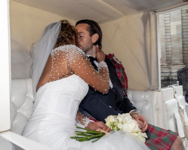 ?? Licensed to London News Pictures. 05/07/2025. London, UK. Mel B kisses her new husband, Rory McPhee as they leave St Paul's Cathedral in central London as newlyweds. Photo credit: Marcin Nowak/LNP