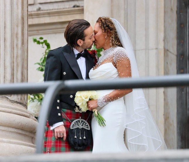 BGUK_3290761 - London, UNITED KINGDOM Melanie Brown aka Scary Spice flashes her wedding ring as she passionately kisses new husband Rory McPhee as she???s joined for photos with family and friends on the church steps Pictured: Melanie Brown and Rory McPhee and family BACKGRID UK 5 JULY 2025 BYLINE MUST READ: Mattpapz / BACKGRID UK: +44 208 344 2007 / uksales@backgrid.com USA: +1 310 798 9111 / usasales@backgrid.com *Pictures Containing Children Please Pixelate Face Prior To Publication*