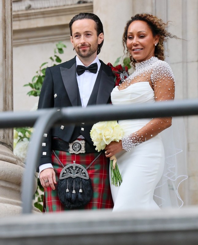 BGUK_3290761 - London, UNITED KINGDOM Melanie Brown aka Scary Spice flashes her wedding ring as she passionately kisses new husband Rory McPhee as she???s joined for photos with family and friends on the church steps Pictured: Melanie Brown and Rory McPhee and family BACKGRID UK 5 JULY 2025 BYLINE MUST READ: Mattpapz / BACKGRID UK: +44 208 344 2007 / uksales@backgrid.com USA: +1 310 798 9111 / usasales@backgrid.com *Pictures Containing Children Please Pixelate Face Prior To Publication*