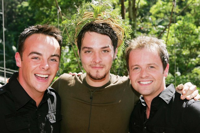 Anthony McPartlin, Matt Willis and Declan Donnelly stand next to each other on I'm a Celebrity Get Me Out of Here in 2006.