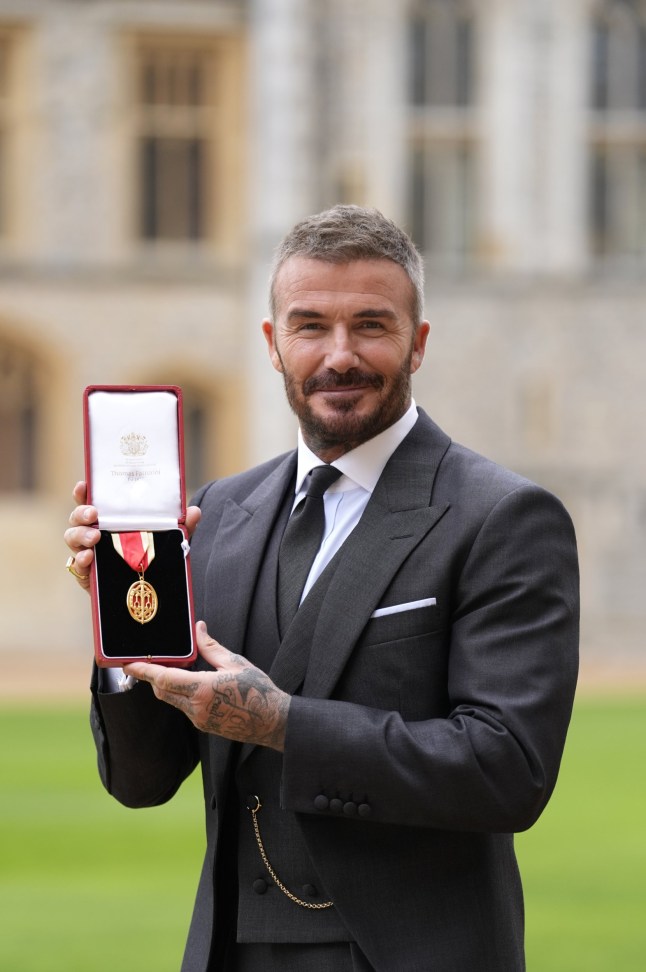 WINDSOR, ENGLAND - NOVEMBER 4: Sir David Beckham poses after he was made a Knight Bachelor at an investiture ceremony at Windsor Castle on November 4, 2025 in Windsor, England. (Photo by Andrew Matthews - Pool/Getty Images)