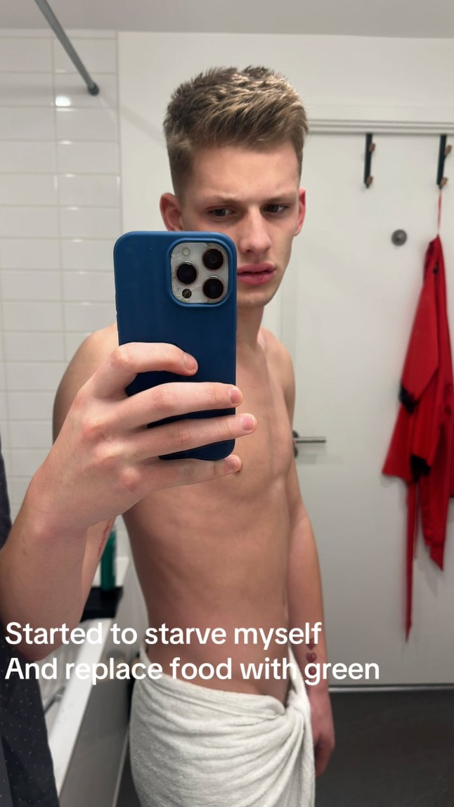 Freddy Brazier in an selfie, topless holding a phone