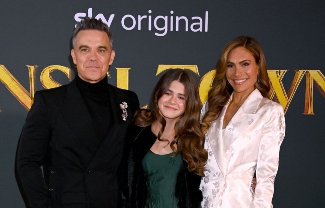 Robbie Williams, Teddy Williams and Ayda Field smile together at the Tinsel Town film premiere