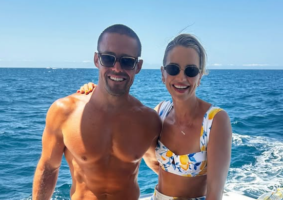 Spencer Matthews with wife Vogue Williams on boat in swimming stuff.